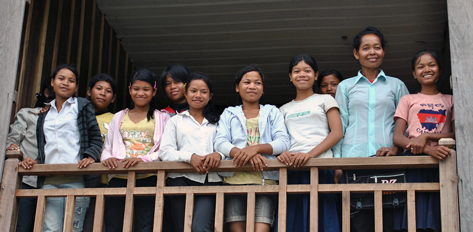 Sieng Ry (second from right), who is now the housemother at the dormitory, pictured with the first generation of Middle School students to study in Srayang