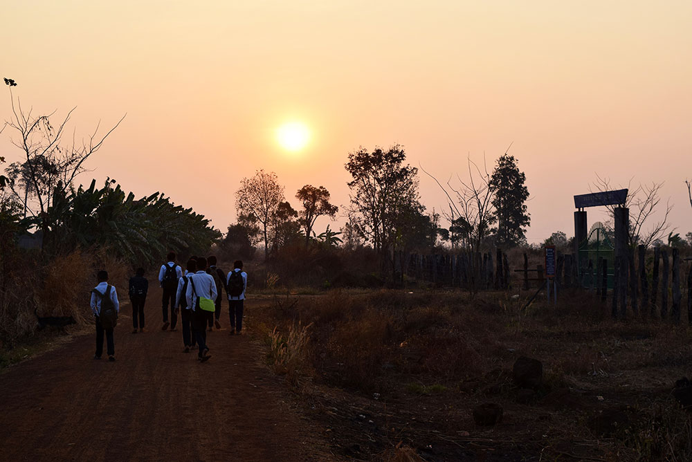 PLF students walk to Srayang Secondary School with the sunrise