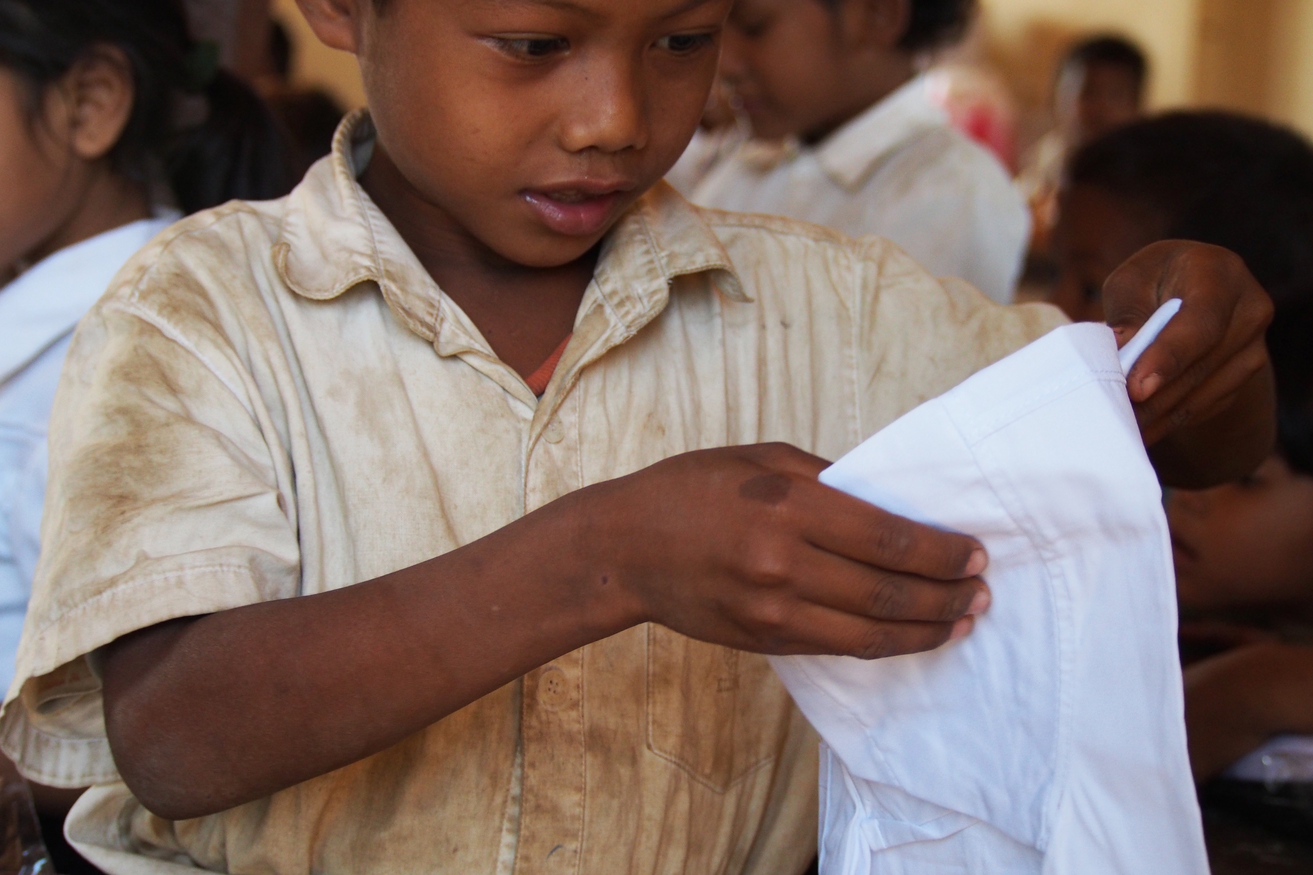 Great uniform shot Boy in dirty uniform receives new school shirt